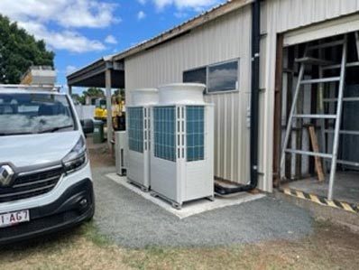 All Electrical technicians at work on an air con installation
